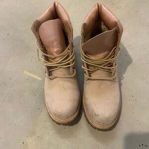 Pink Timberland boots with gold laces